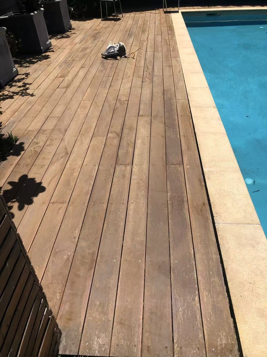 Floor sander taking the deck back to raw timber after the repair