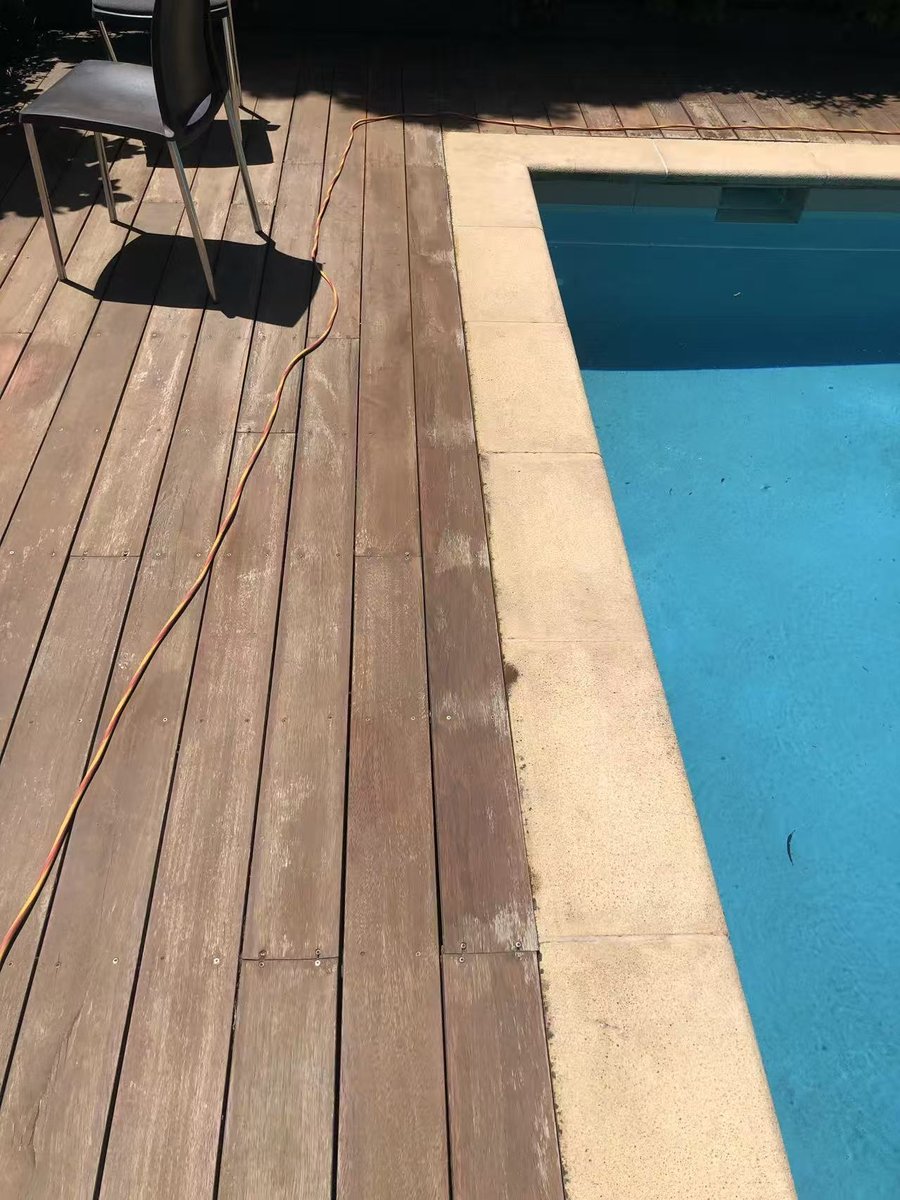 Deck sanded back to bare timber, now level with the coping