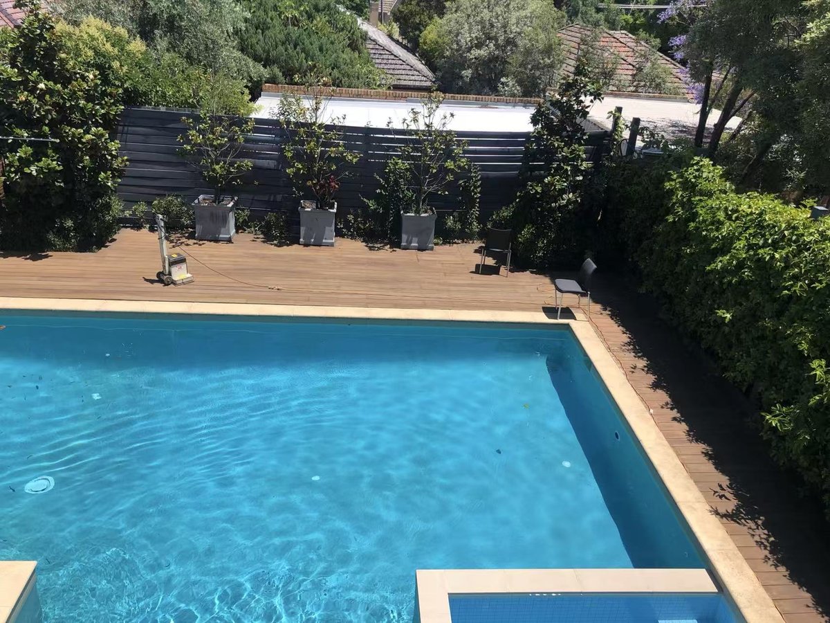 Sanding in progress across the re-levelled poolside deck