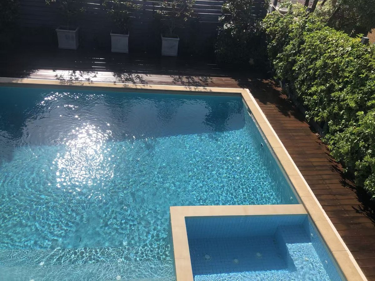 Restored deck sitting level around the pool and spa