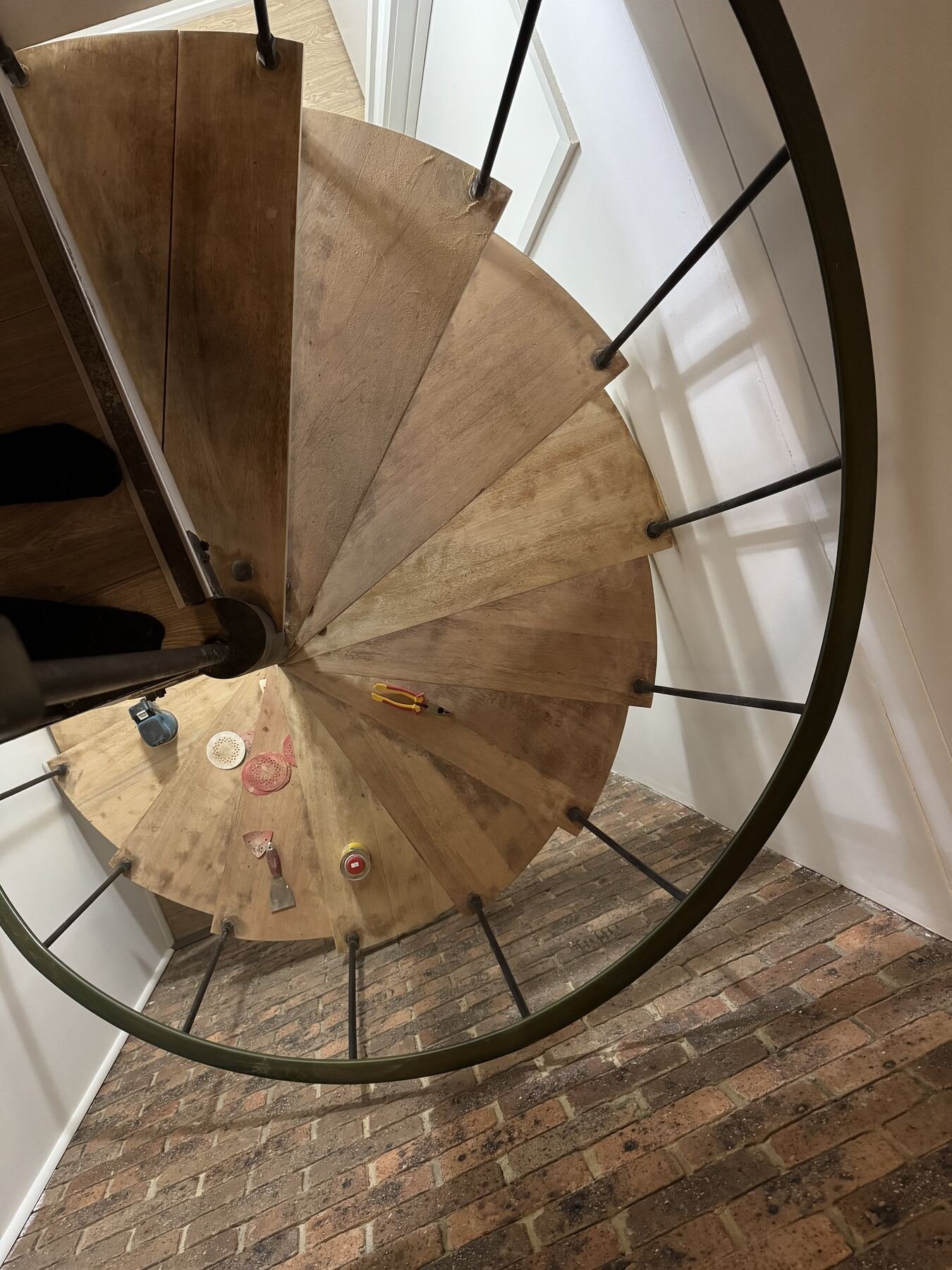 Overhead view of the spiral staircase sanded back to clean bare timber