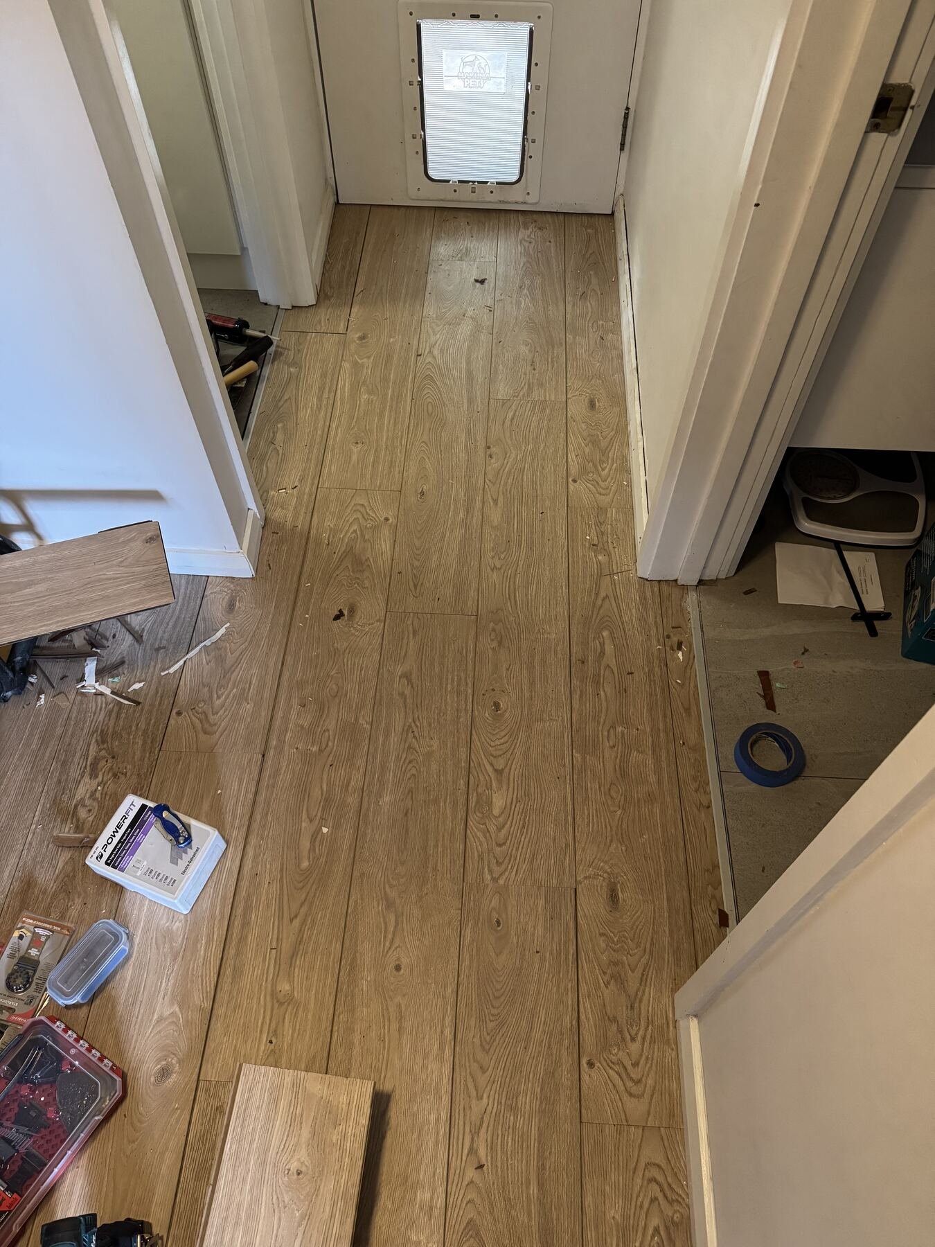 Floating floorboards laid through the hallway to the rear door