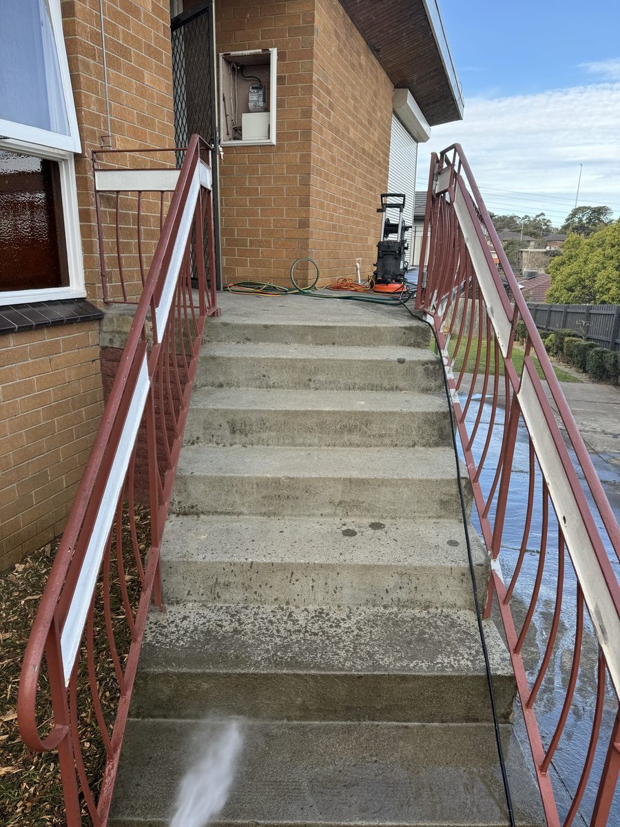 Concrete front steps after acid wash and high-pressure clean, before painting