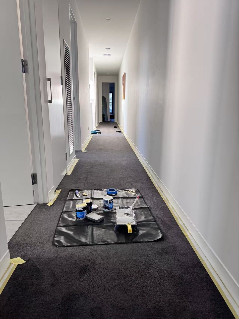 Caulfield pre-auction paint touch-ups — hallway touch-ups underway with Dulux touch-up paint on the drop sheet