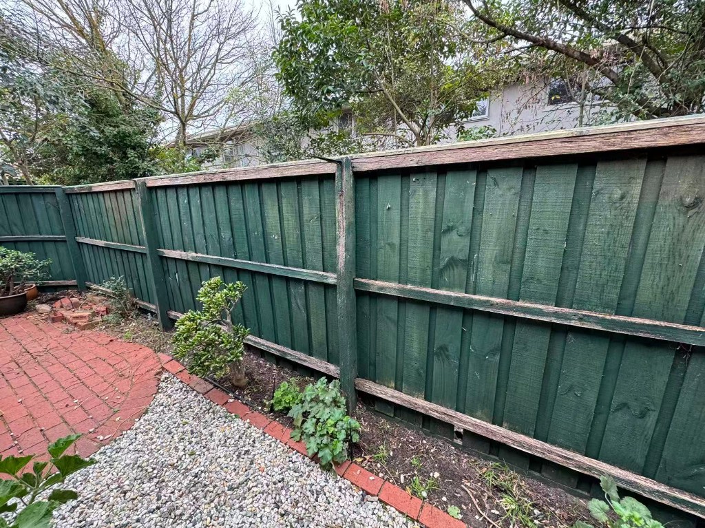 Detail shot of restored picket gate and letterbox area before final upgrade