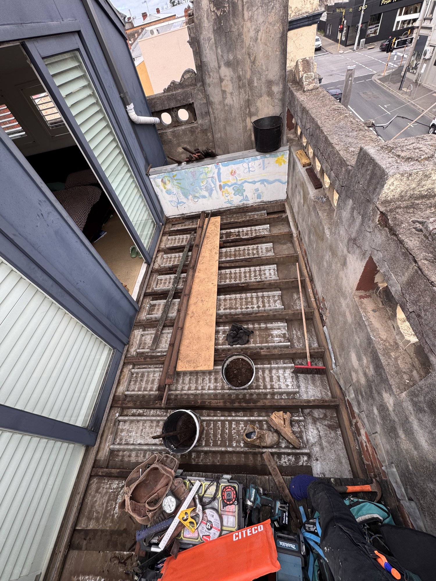 Rooftop terrace cleared back to structure ahead of the rebuild
