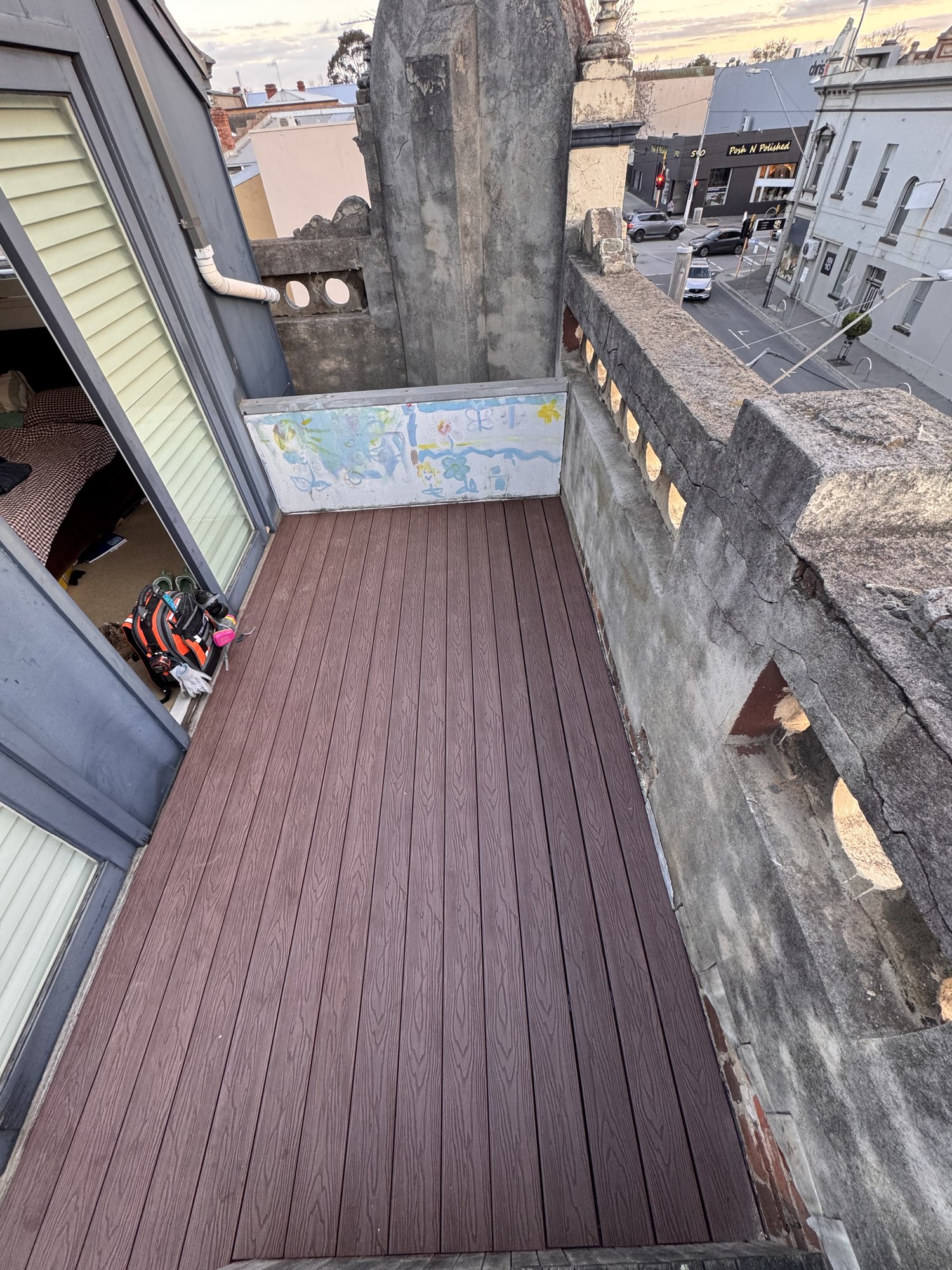 New composite boards laid across the rebuilt rooftop deck