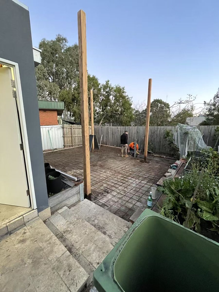 Formwork and reinforcing steel set out for the new concrete slab at dusk