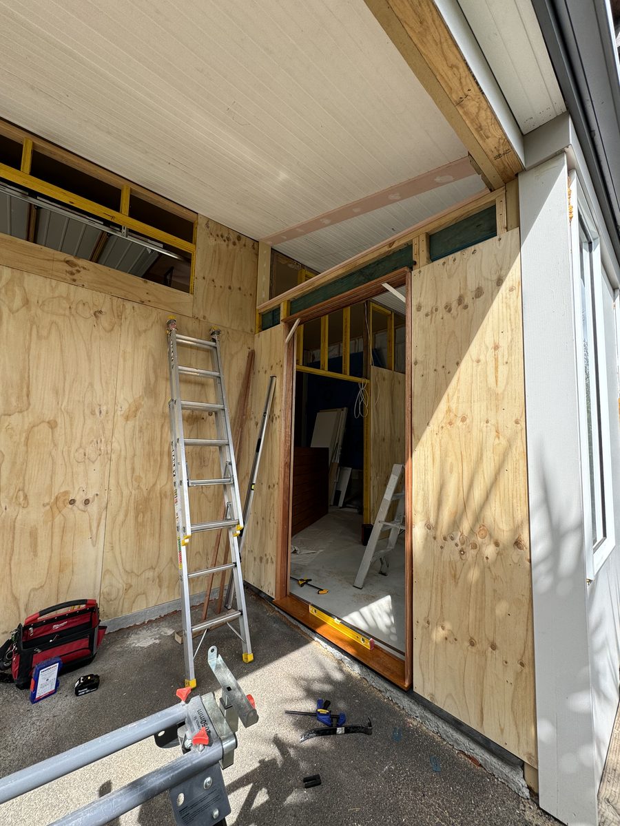 Interior view of the framed doorway mid-install